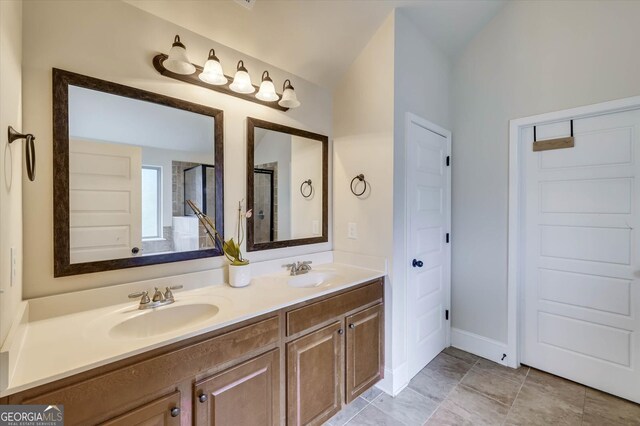 bathroom with vanity, vaulted ceiling, and walk in shower