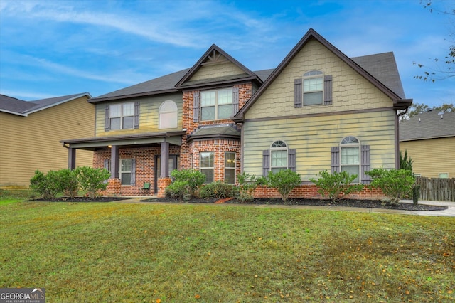 craftsman-style house featuring a front lawn