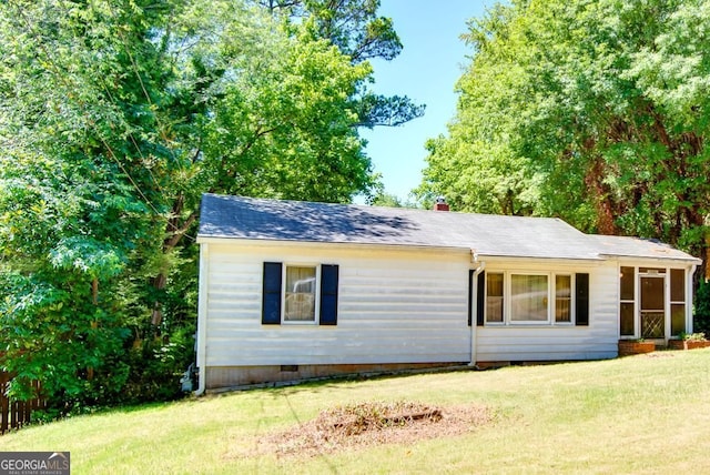 view of property exterior with a yard