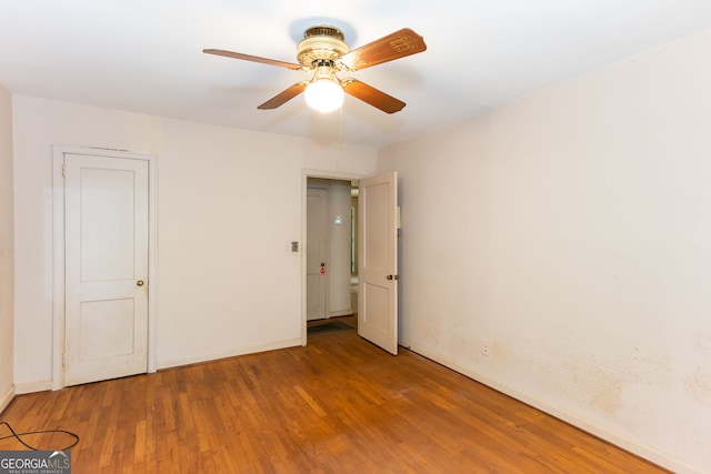 unfurnished bedroom with hardwood / wood-style floors and ceiling fan