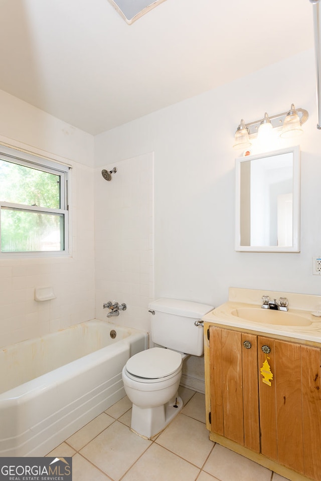 full bathroom with tile patterned floors, tiled shower / bath combo, toilet, and vanity