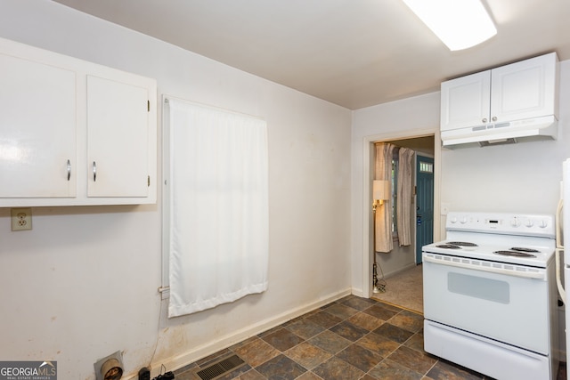 kitchen with white electric range oven and white cabinetry