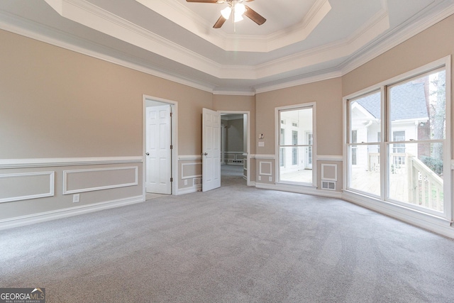 1510 Natchez Way, Grayson, GA 30017 - carpeted spare room with a ceiling fan, a raised ceiling, ornamental molding, a decorative wall, and wainscoting
