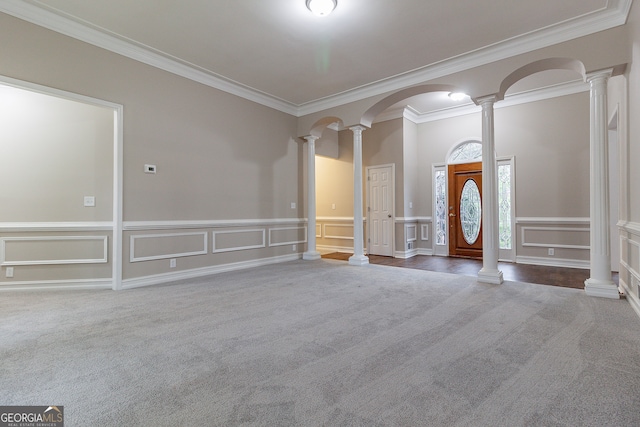 interior space featuring carpet floors, decorative columns, and crown molding