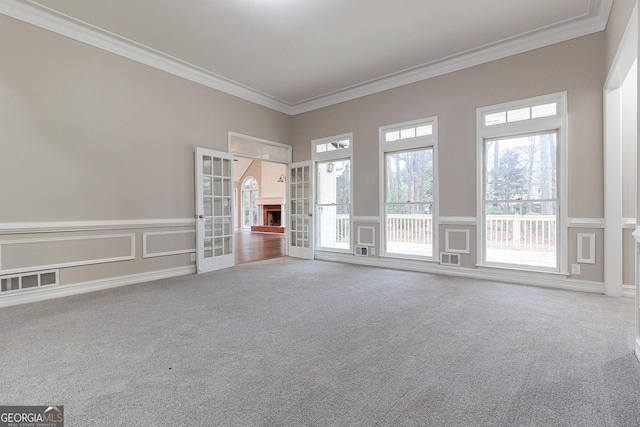 1510 Natchez Way, Grayson, GA 30017 - unfurnished room featuring carpet floors, ornamental molding, french doors, and a decorative wall