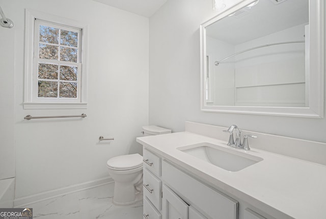 bathroom with toilet and vanity