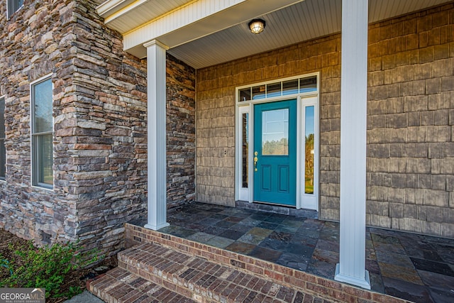 entrance to property with a porch