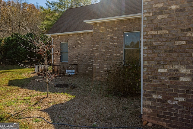 view of property exterior with a yard