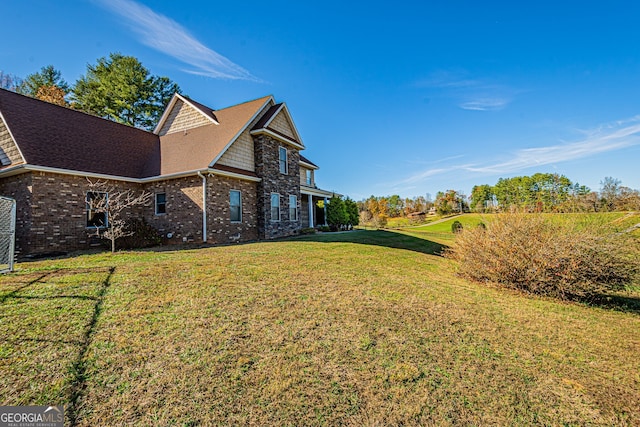 view of property exterior with a lawn