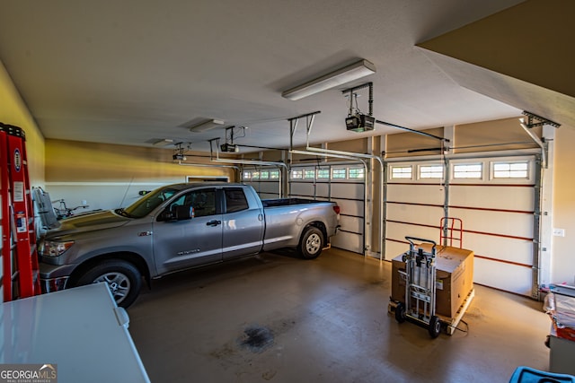 garage featuring a garage door opener