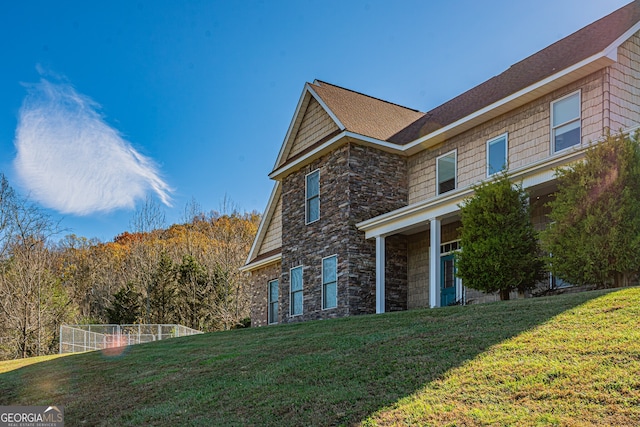 view of home's exterior featuring a yard