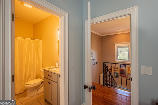 bathroom featuring curtained shower, crown molding, toilet, vanity, and hardwood / wood-style flooring