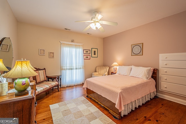 bedroom featuring ceiling fan and wood-type flooring