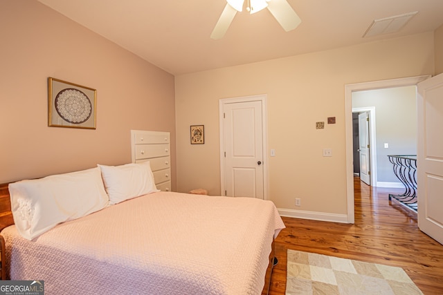 bedroom featuring ceiling fan and light hardwood / wood-style floors