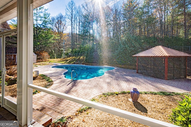 view of pool featuring a patio area