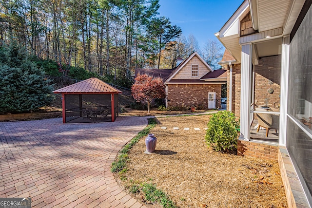 view of yard with a gazebo and a patio