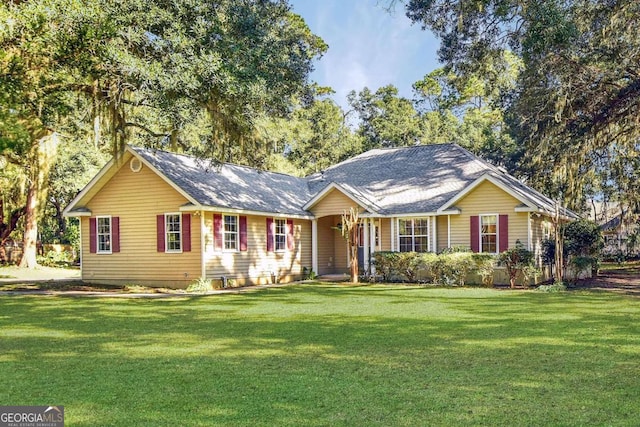 single story home featuring a front yard