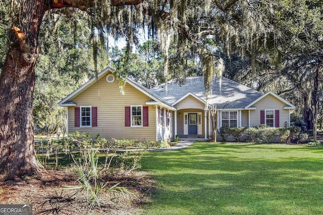 ranch-style home featuring a front yard