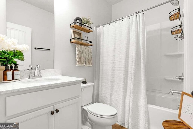 full bathroom with shower / bathtub combination with curtain, vanity, and toilet