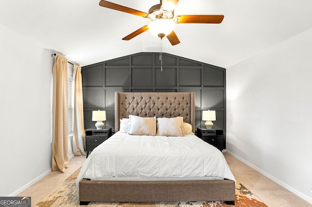 carpeted bedroom with vaulted ceiling and ceiling fan