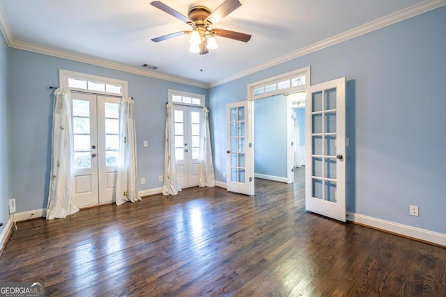 spare room featuring french doors, crown molding, ceiling fan, and dark wood-type flooring