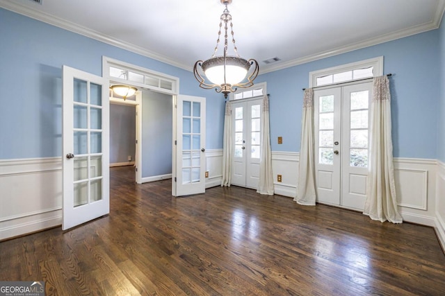 unfurnished dining area featuring french doors, dark hardwood / wood-style flooring, and ornamental molding