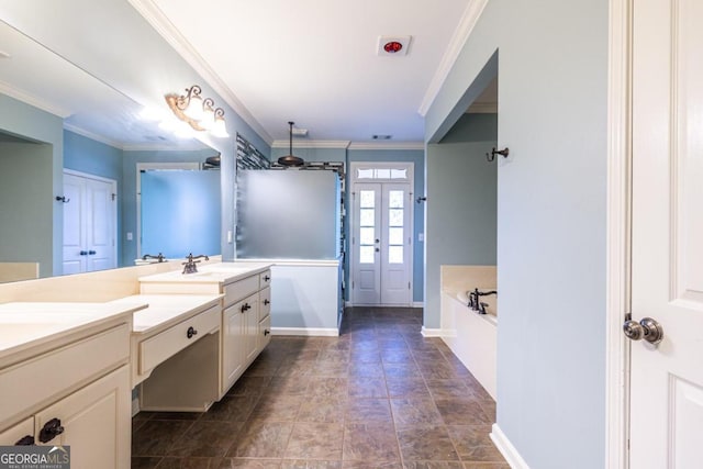 bathroom with ornamental molding, vanity, and a bathing tub