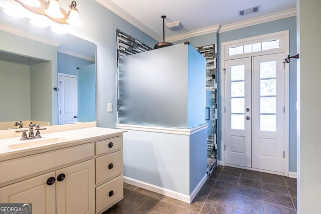 bathroom featuring vanity, a shower with door, crown molding, and french doors