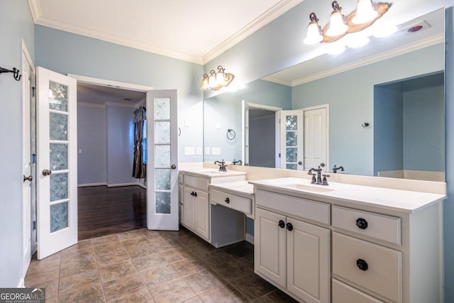 bathroom with vanity, hardwood / wood-style flooring, and crown molding