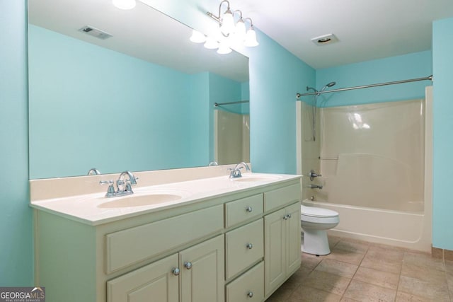 full bathroom with toilet, tile patterned floors, vanity, and bathing tub / shower combination