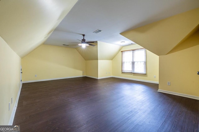 additional living space with dark hardwood / wood-style floors, ceiling fan, and lofted ceiling