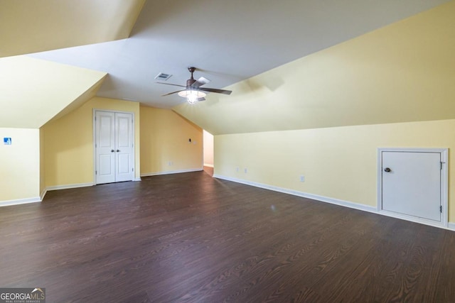 bonus room with dark hardwood / wood-style floors, ceiling fan, and vaulted ceiling