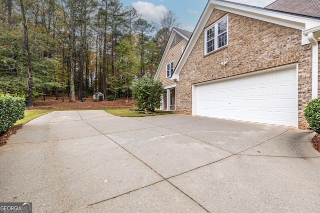 view of side of home with a garage