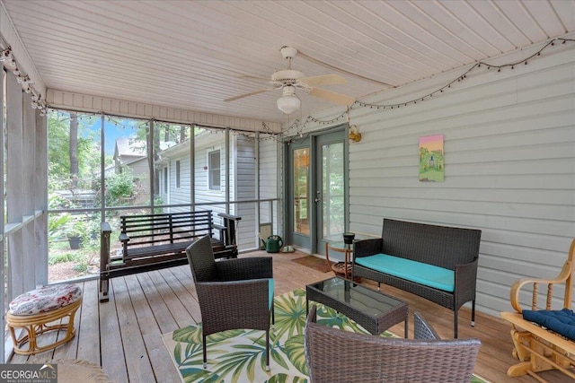 sunroom / solarium featuring ceiling fan and wooden ceiling