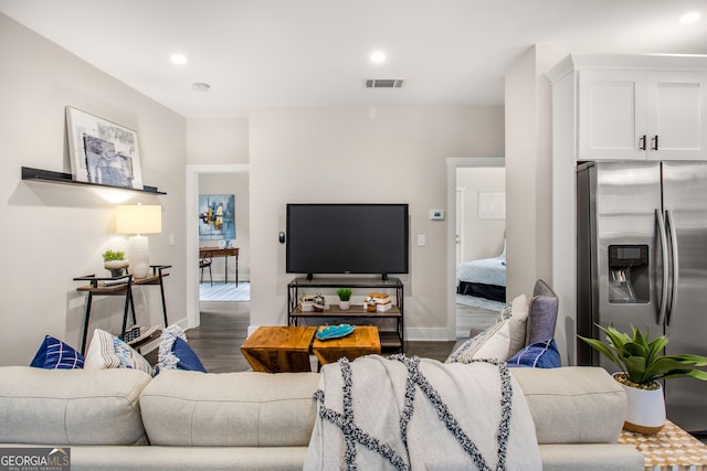 living room with dark hardwood / wood-style floors