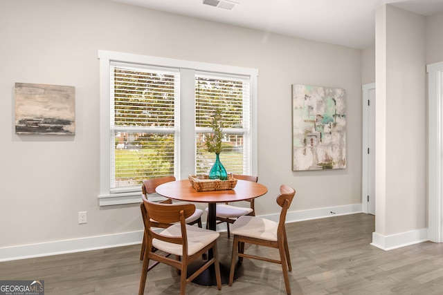 dining area featuring dark hardwood / wood-style floors