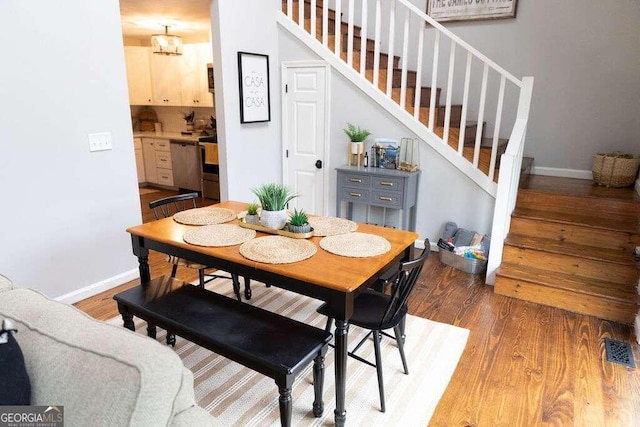 dining space featuring hardwood / wood-style floors