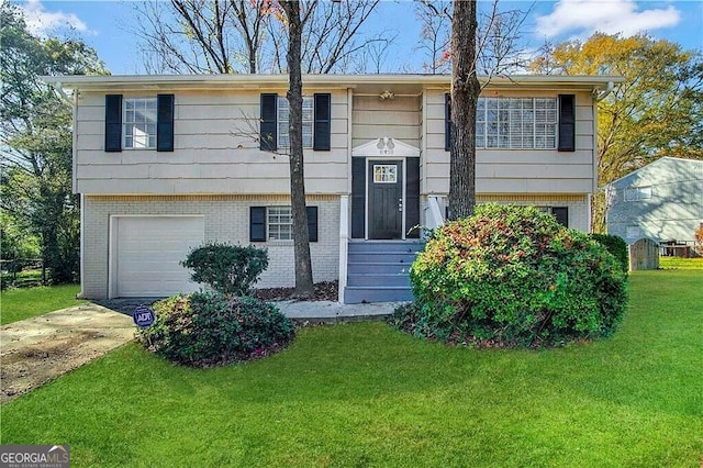 raised ranch with a garage and a front lawn