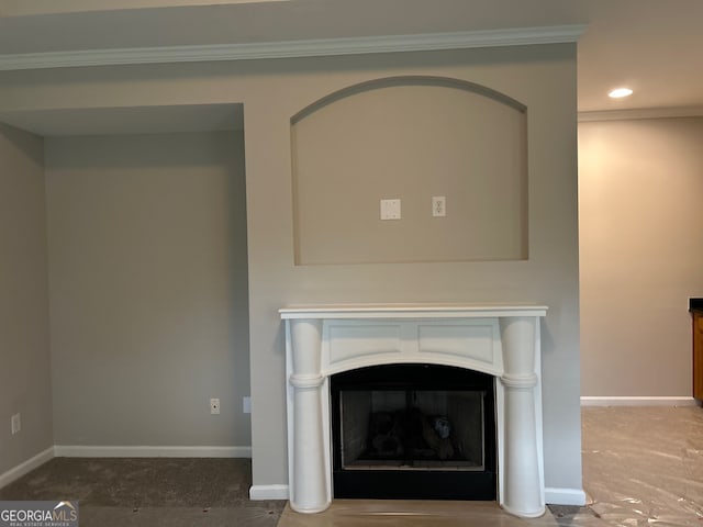 details featuring a fireplace and crown molding