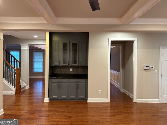 kitchen with gray cabinetry, tasteful backsplash, beamed ceiling, and dark wood-type flooring