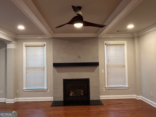 unfurnished living room with beam ceiling, dark hardwood / wood-style flooring, and ceiling fan