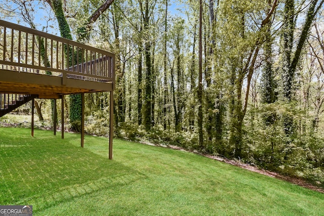 view of yard featuring a wooden deck