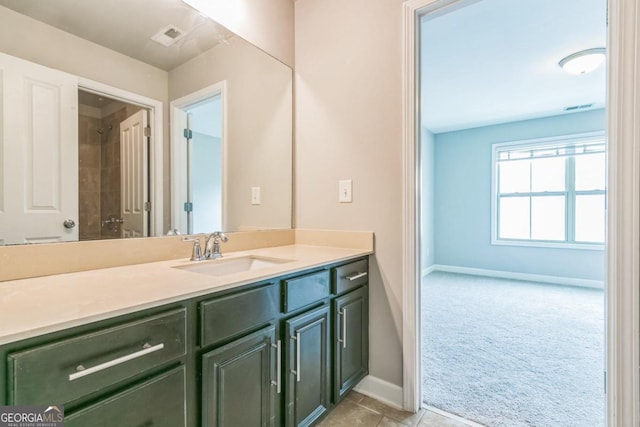 bathroom featuring tile patterned flooring and vanity