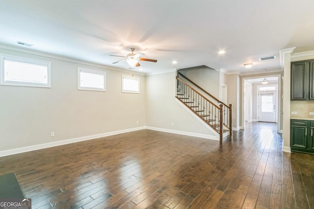 interior space featuring dark hardwood / wood-style floors, ceiling fan, and crown molding