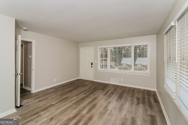 empty room featuring hardwood / wood-style flooring