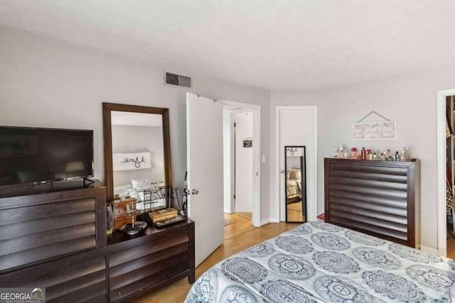 bedroom with light wood-type flooring