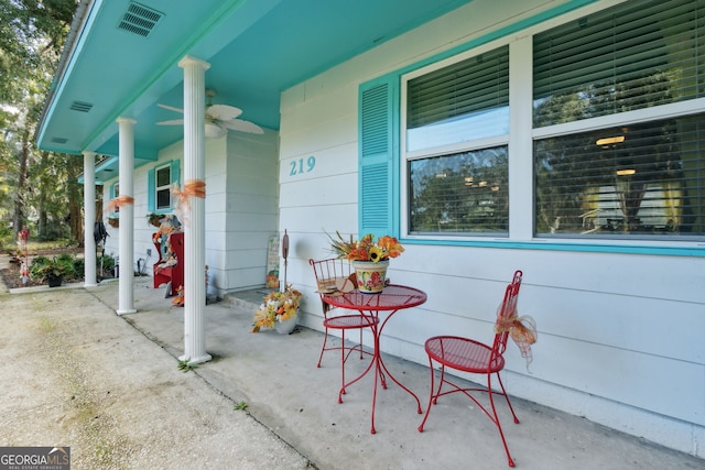 view of patio featuring ceiling fan and a porch