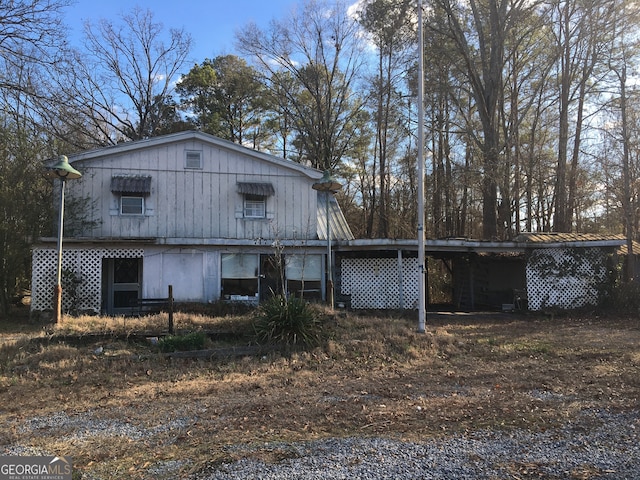 exterior space with a carport