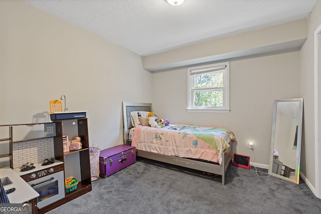 carpeted bedroom with a textured ceiling