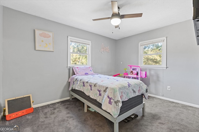 bedroom with carpet flooring, multiple windows, and ceiling fan